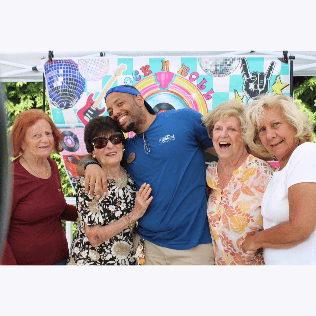 Residents posed for pictures in the Rock N Roll Photo Booth at the Classic Car Show.