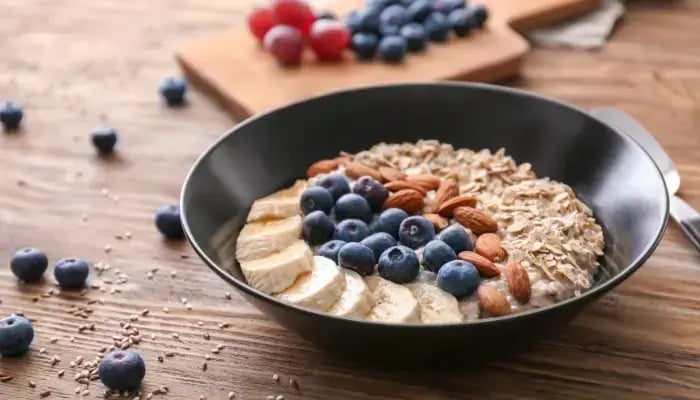 Whole-grain oatmeal with blueberries and sliced almonds
