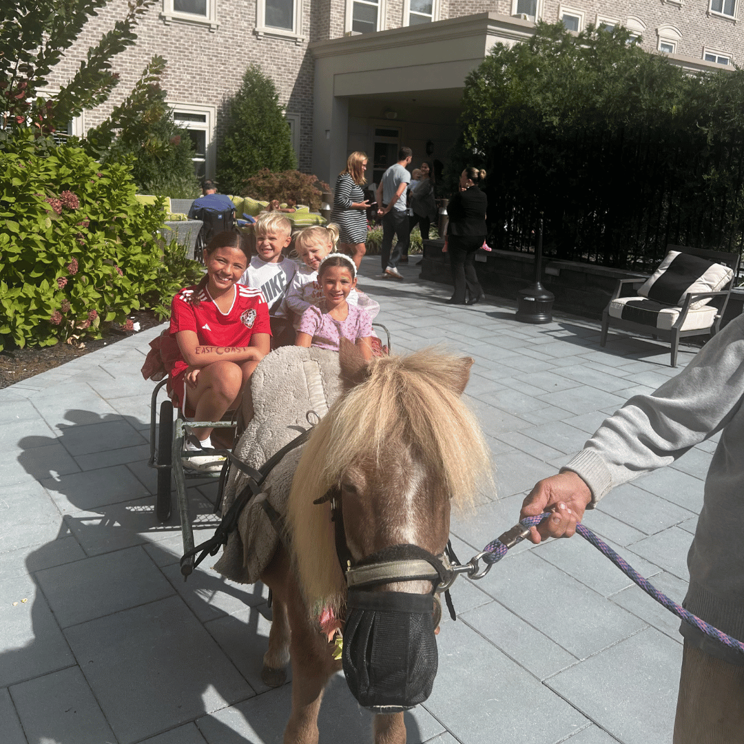 Grandchildren gathered for the pony ride, and to play games and have their faces painted.