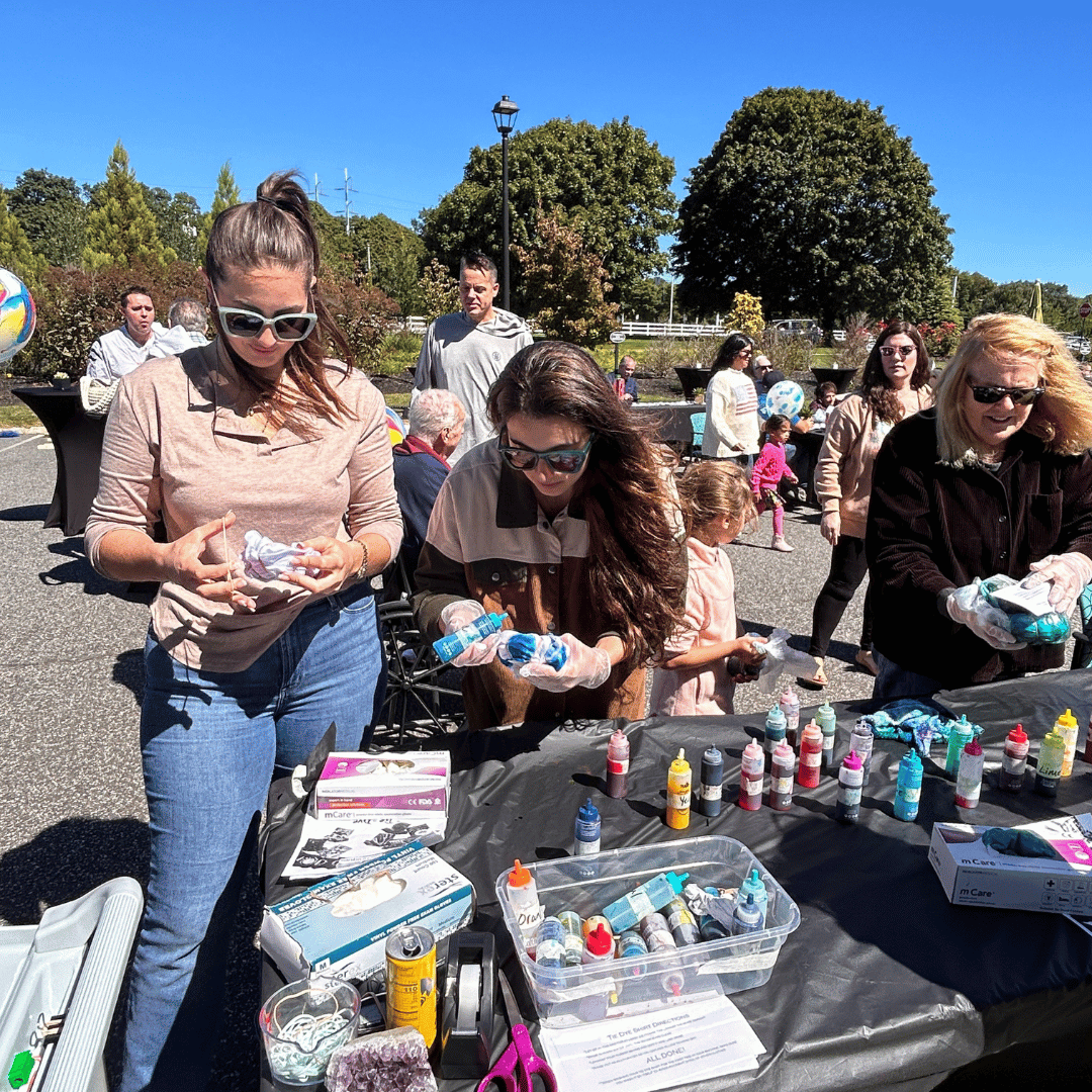 Residents and their families tie-dyed tee shirts at the Grandparents Day Carnival.