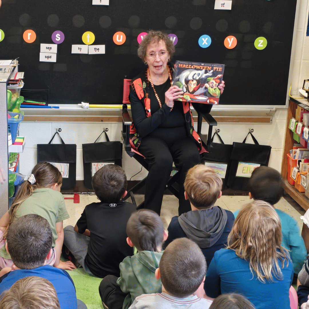 A captivated audience of children listen to a picture book read by a Massapequa resident.