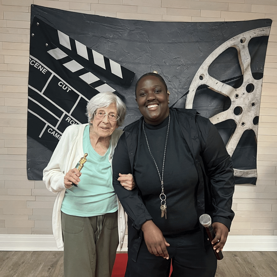 Resident and team member at The Bristal at Westbury pose for pictures after accepting Oscars