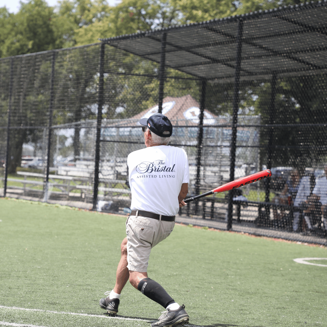 Senior Softball batter hits a homerun
