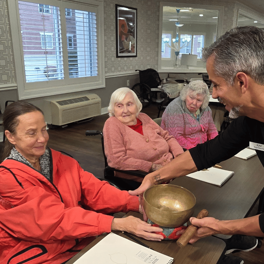 Residents at The Bristal at Massapequa listening