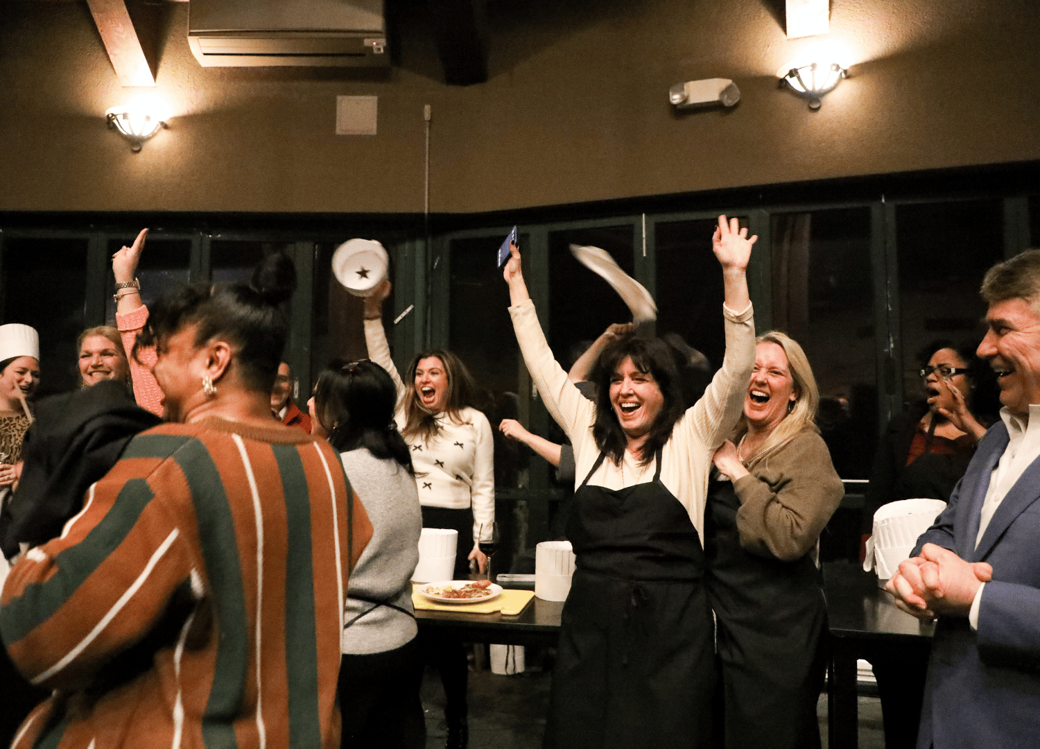 teams celebrate their winning dish from the Iron Chef competition at The 2026 Leadership Summit for The Bristal Assisted Living